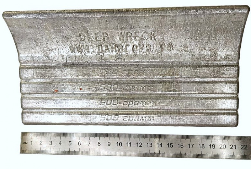 Длина груза составляет примерно 21см.